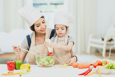 Midsection of woman preparing food