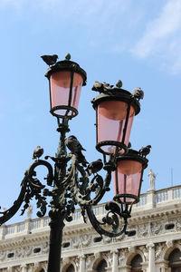 Low angle view of street light against sky