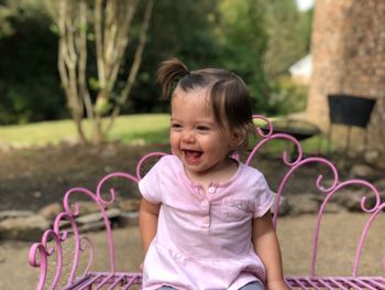 Portrait of happy girl smiling outdoors