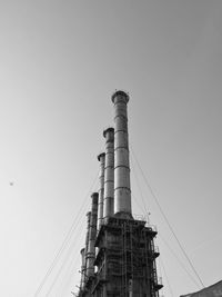 Low angle view of factory against clear sky