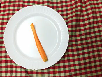 High angle view of egg in plate on table