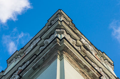 Low angle view of historical building against blue sky