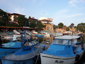 Boats moored at harbor