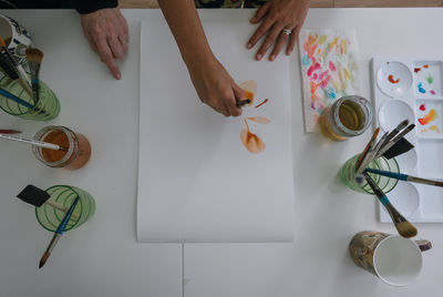 High angle view of paintbrushes on table