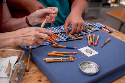 Cropped hands of man working at workshop