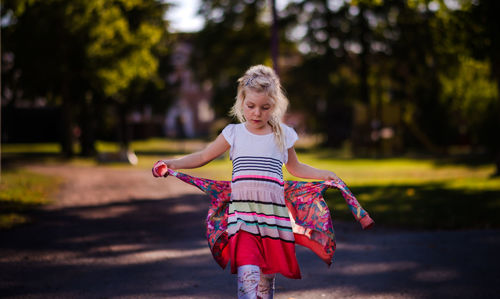 Portrait of happy girl playing in park