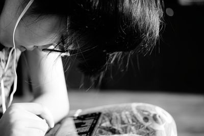 Close-up portrait of a girl holding smart phone