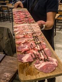 Man working on table at market