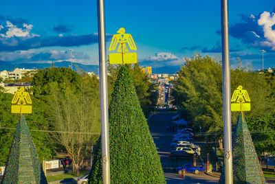 Panoramic view of yellow city against blue sky