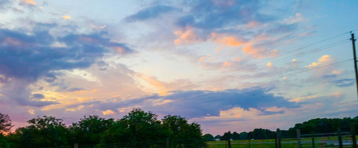 Scenic view of landscape against cloudy sky