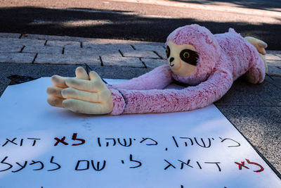 High angle view of stuffed toy on blackboard