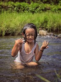 Full length of a girl in water