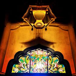 Low angle view of illuminated chandelier