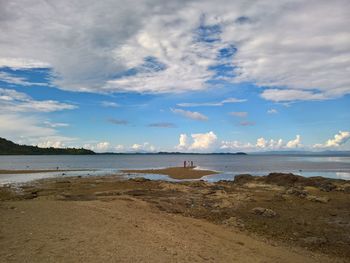 Scenic view of beach against sky