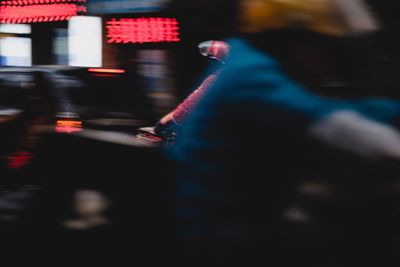 Low section of woman at night