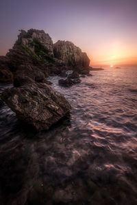 Scenic view of sea against sky during sunset