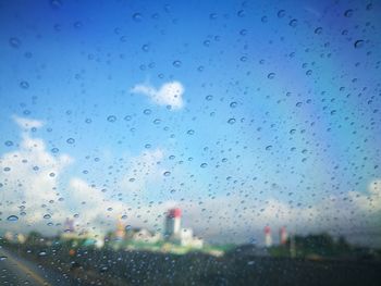 Full frame shot of wet glass window in rainy season