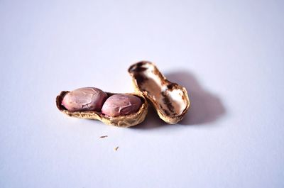 High angle view of chocolate on table against white background