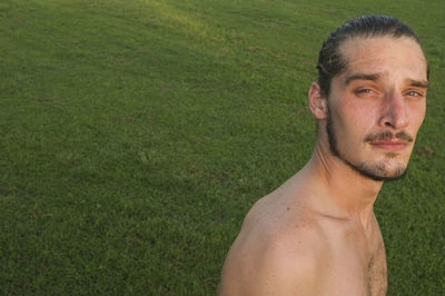 Close-up portrait of shirtless man