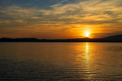 An incredible fiery sunset on italian lake. pusiano lake - italy