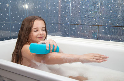 Portrait of smiling boy in bathroom at home