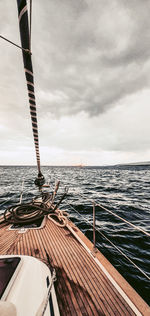 Sailboat sailing on sea against sky