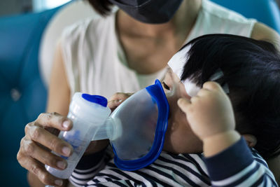 Midsection of woman drinking milk