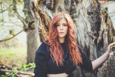 Beautiful redhead young woman outdoor portrait. springtime