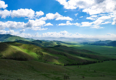 Scenic view of agricultural field against sky