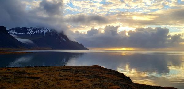 Scenic view of lake against sky during sunset