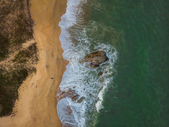 High angle view of rock in sea