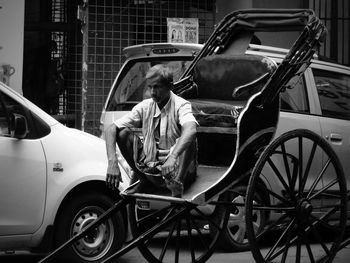 Man sitting in car