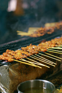 Close-up of meat on barbecue grill