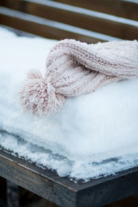 Close-up of snow and hat