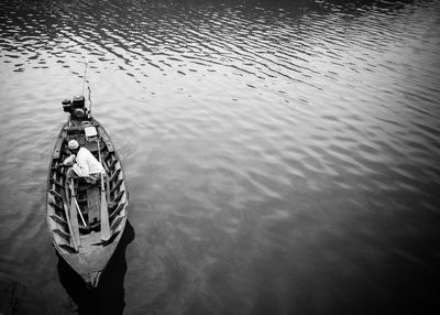 High angle view of man fishing in lake