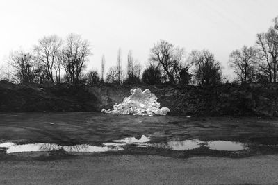 Scenic view of frozen lake against sky