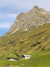 Scenic view of landscape and mountains against sky