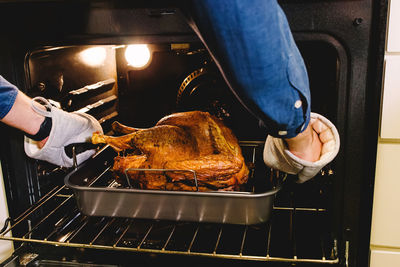 Cropped hand of person preparing food