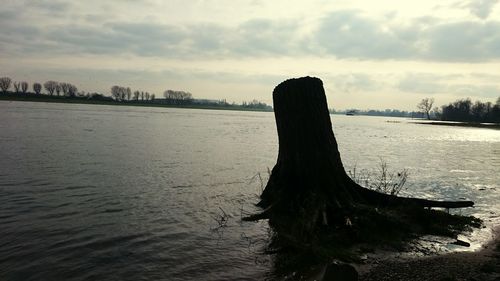 Scenic view of sea against cloudy sky
