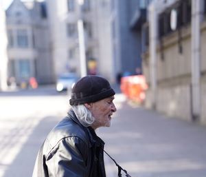 Man looking at city street