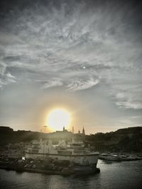 Scenic view of river against sky during sunset