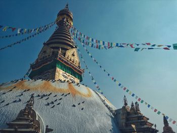 Low angle view of  swayambhunath temple against sky