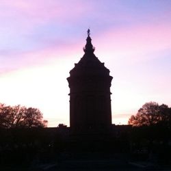 Low angle view of building against sky at sunset