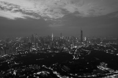 Aerial view of cityscape against sky during sunset