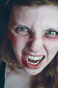 Close-up portrait of angry woman screaming