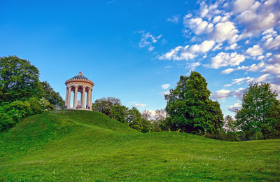 Built structure on landscape against sky