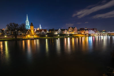 Illuminated buildings at waterfront