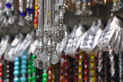 Close-up of decorations hanging in store for sale