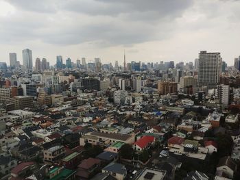 High angle view of buildings in city against sky