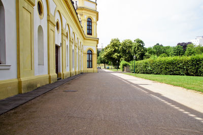 Empty footpath by historic building